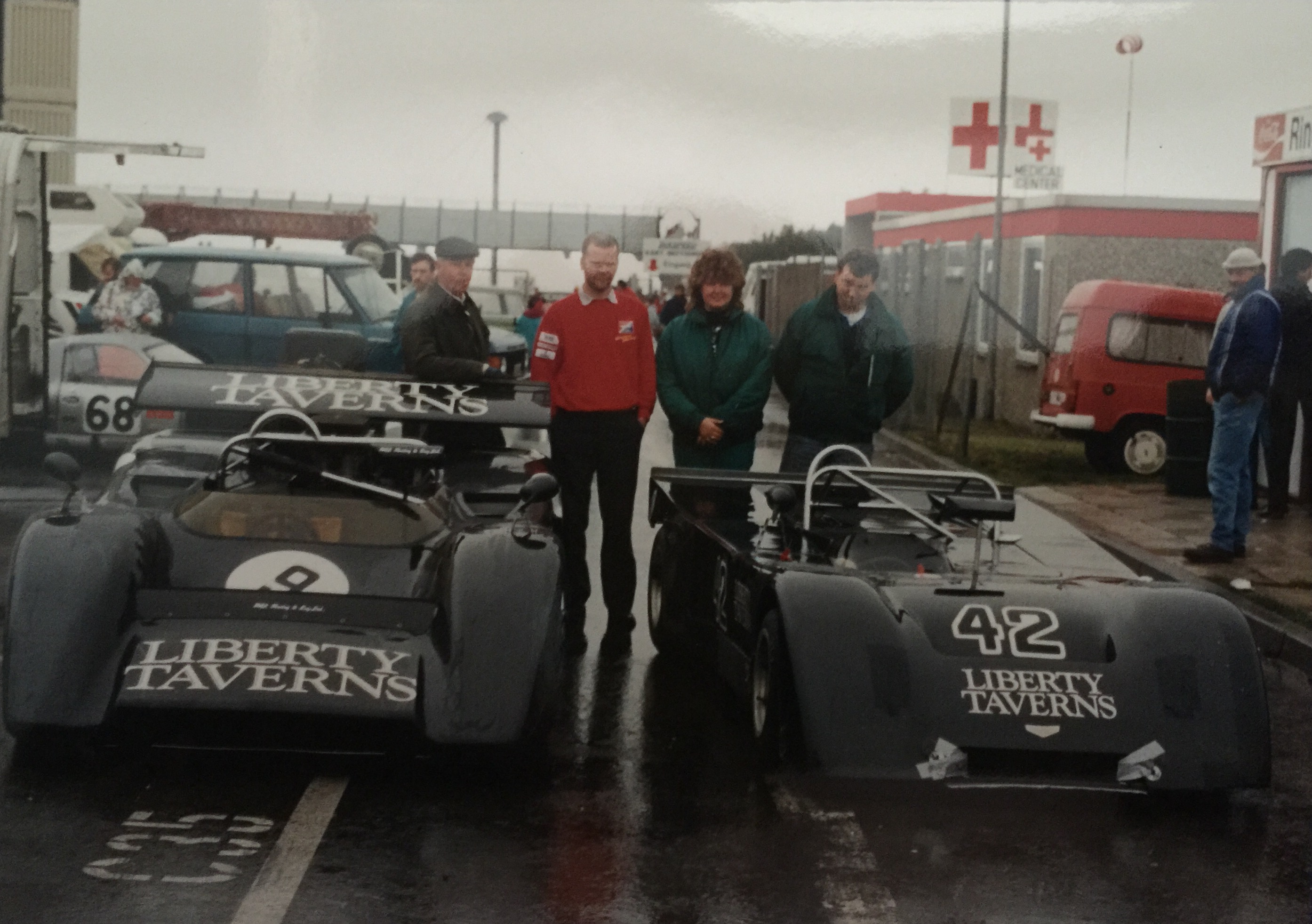 Family and crew with the Liberty Taverns-liveried sports racers
