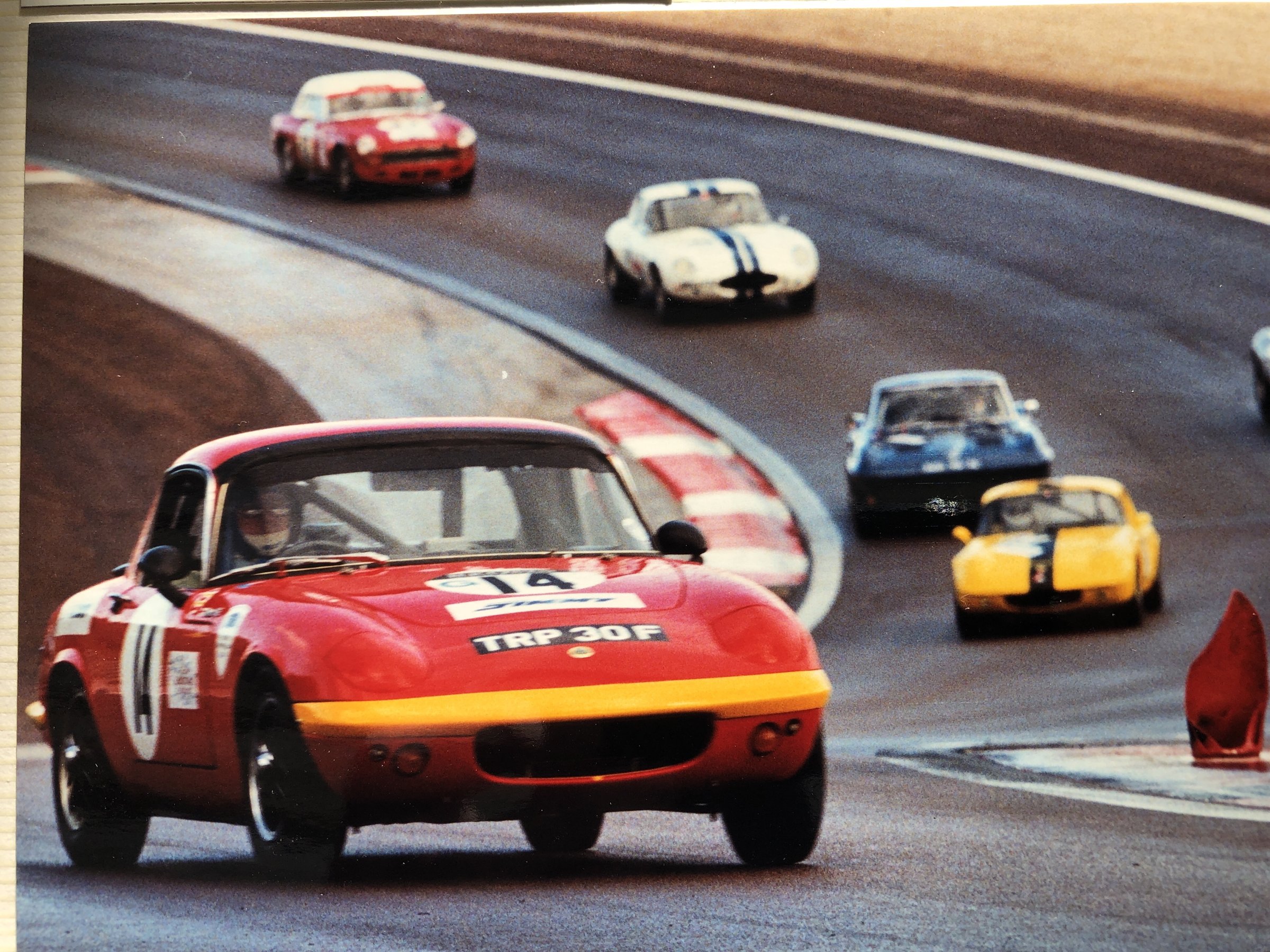 The family Lotus Elan, #14, TRP 30F, on track